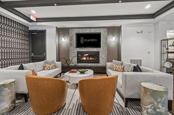 A modern sitting room with a fireplace and a flatscreen tv